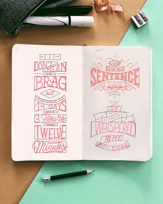 Composición de lettering insertada en cuadrículas dibujadas en un cuaderno